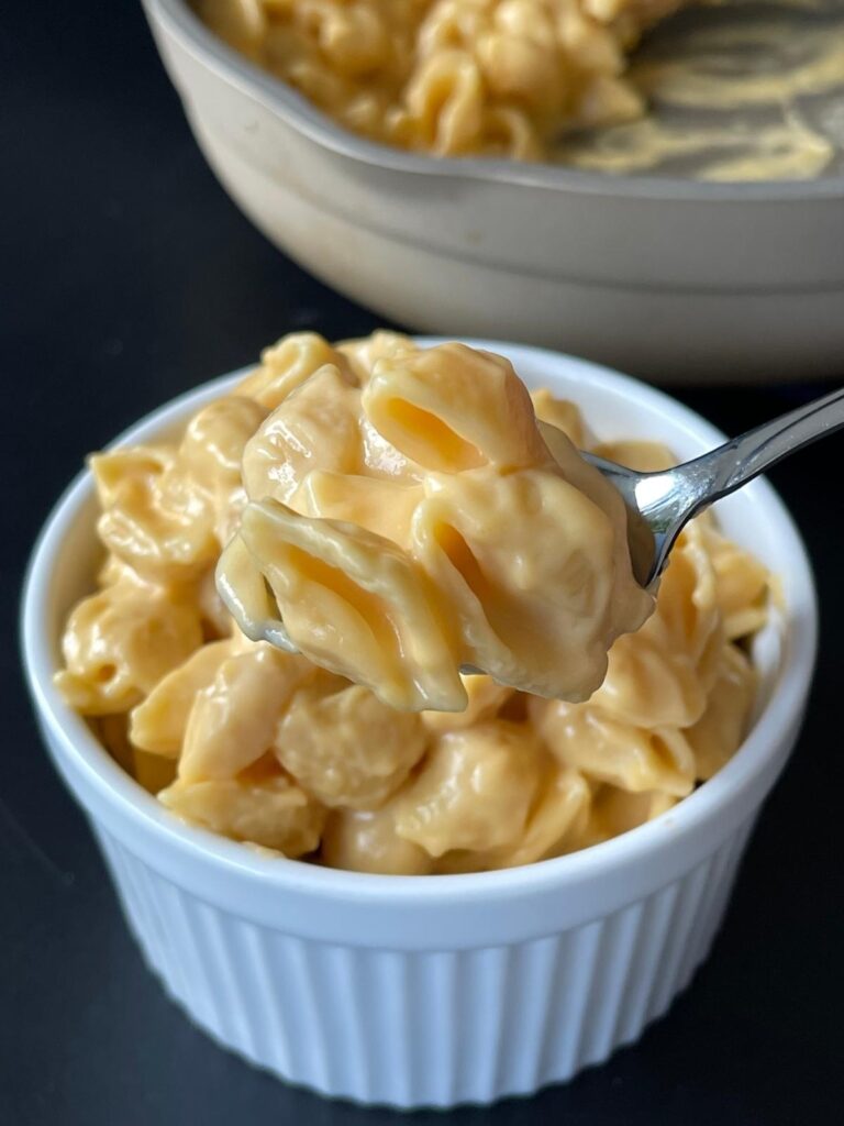 high protein mac and cheese with a bite scooped out