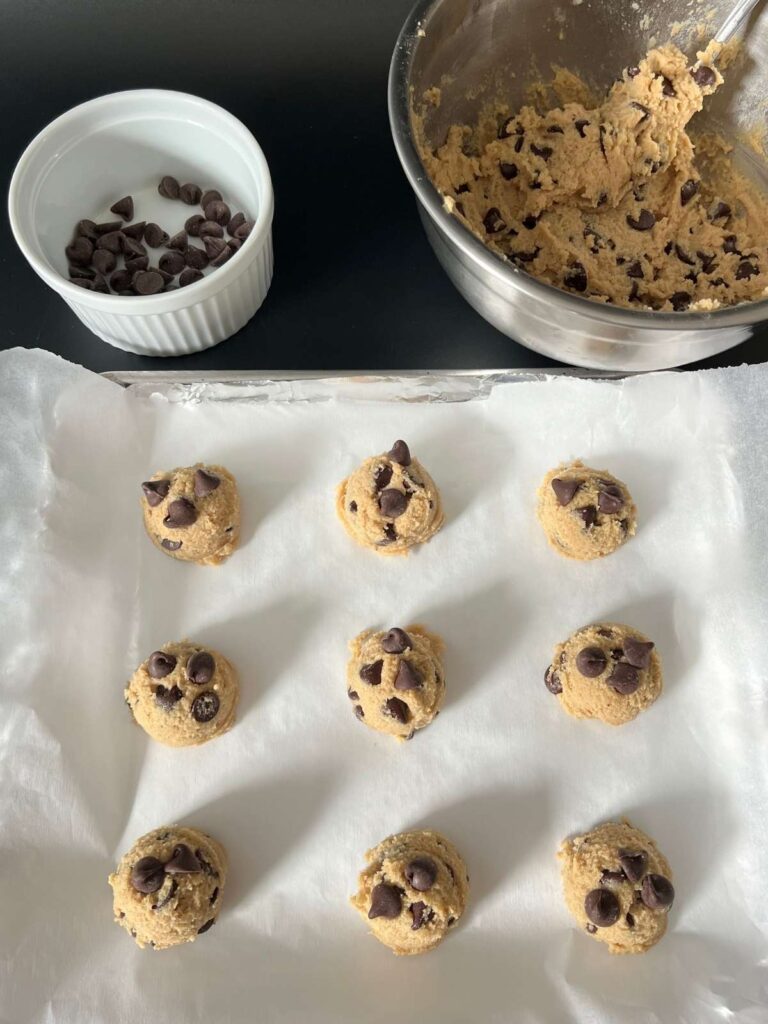 scooping the cookie dough onto the cookie sheet