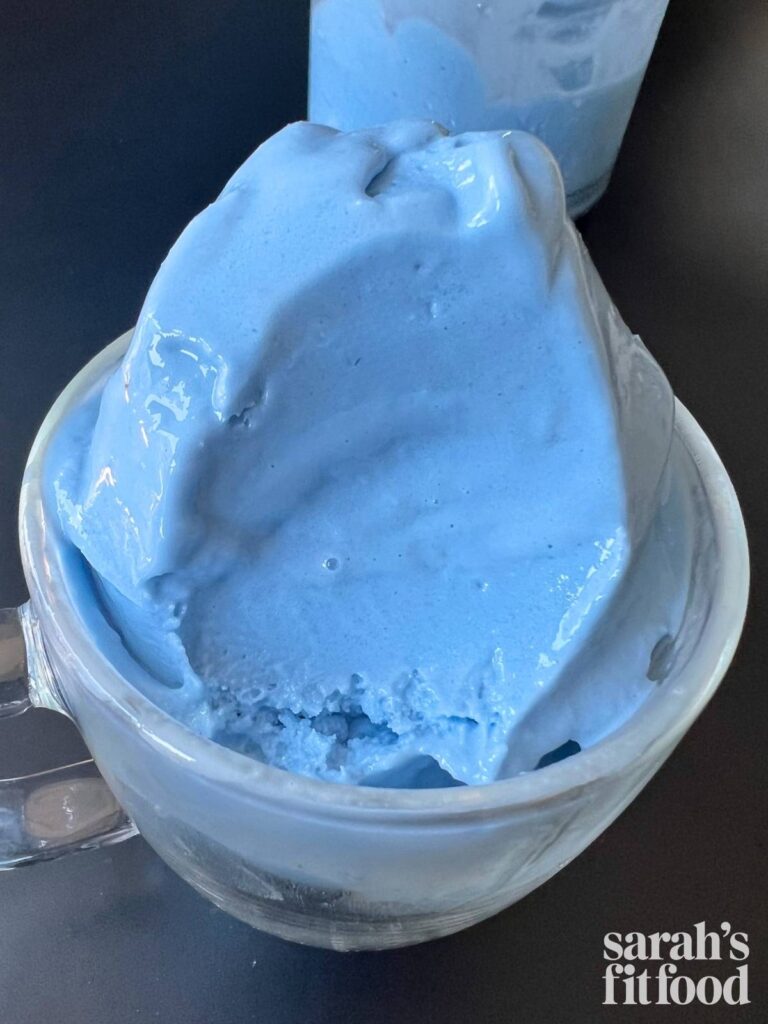 blue raspberry ice cream with a bite taken out