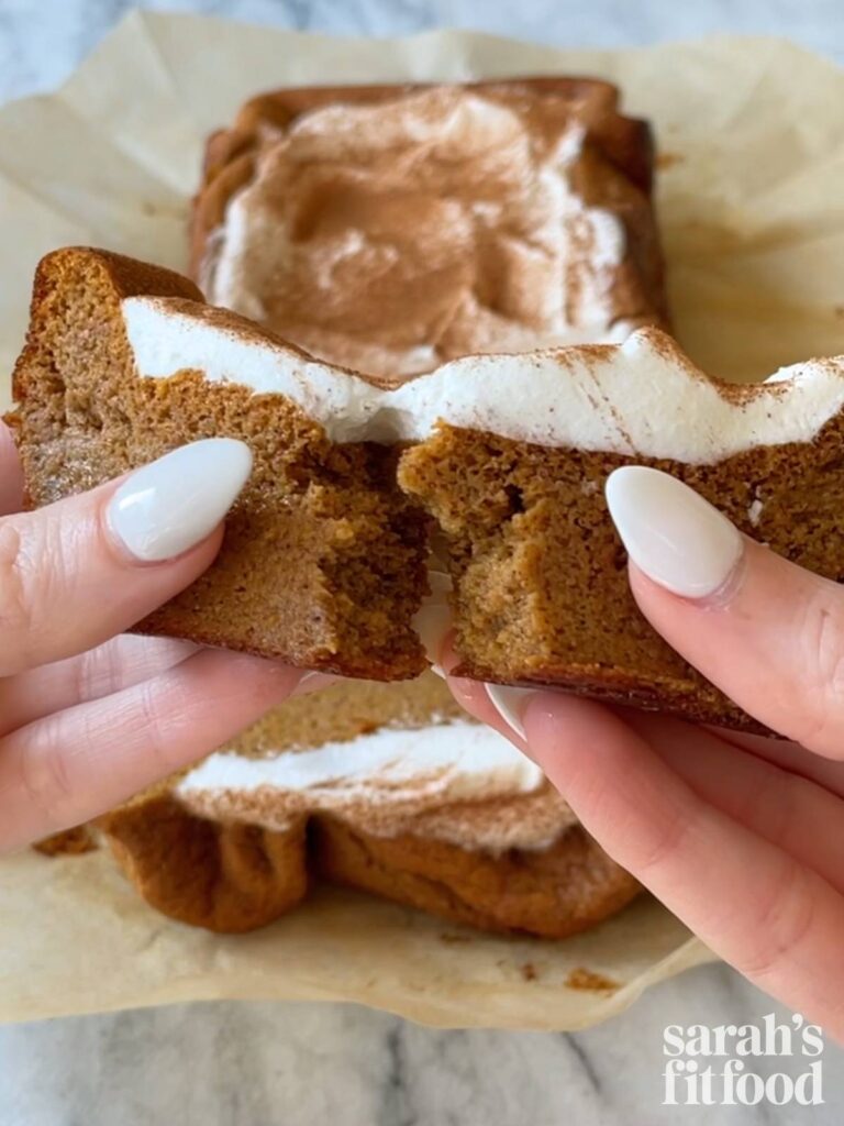 breaking a piece of gluten free sweet potato bread in half