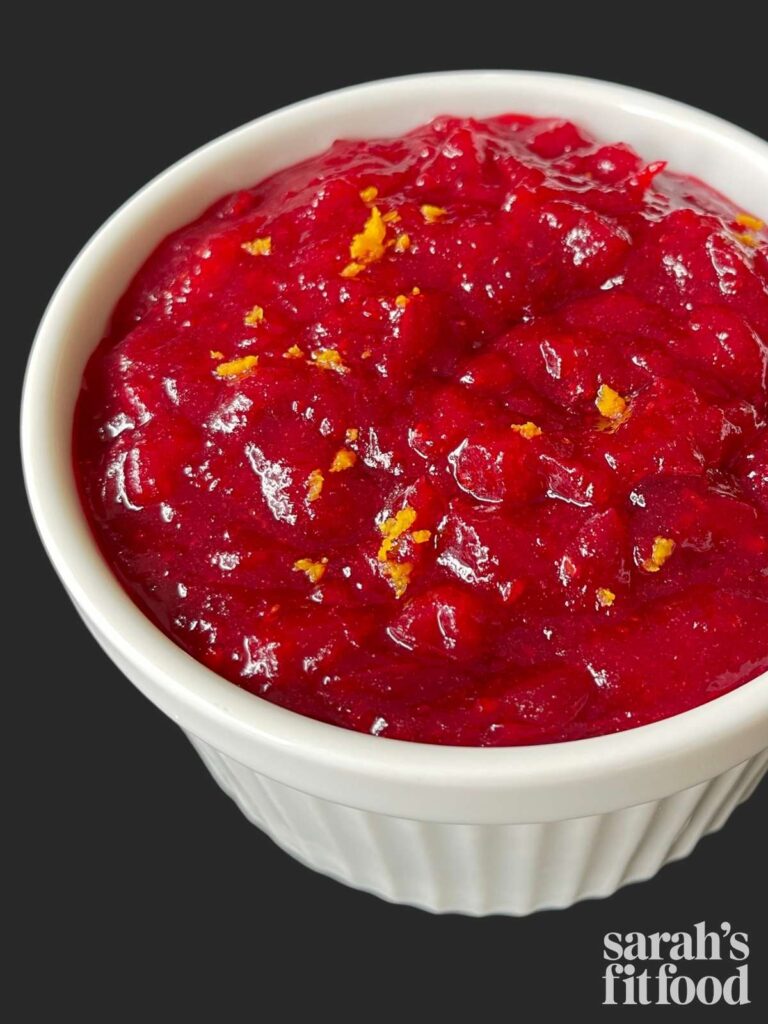 sugar free cranberry sauce in a bowl with orange zest on top
