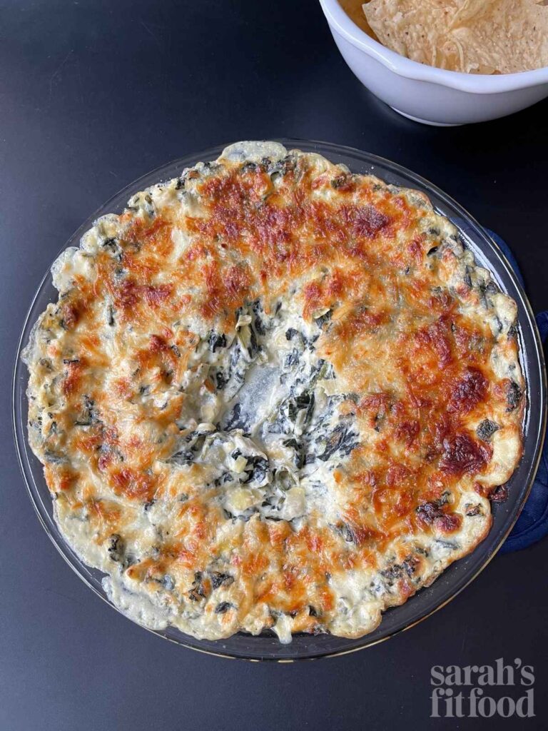 high protein spinach artichoke dip after being dipped into, you can see the creamy cheesy interior